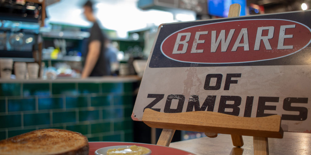 beware of zombies sign in cafe